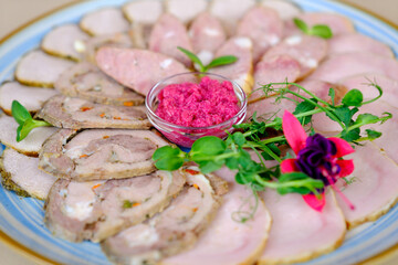 Traditional meat platter with pickles, herbs and beetroot dip on plate. Perfect for gourmet dining. High quality photo