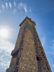  View from below of the historic stone tower against the blue sky - Cabo San Rom&aacute;n Lighthouse, Falc&oacute;n, Venezuela