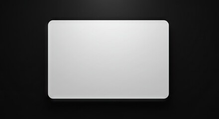 Matte white rectangle with rounded corners on a dark gray surface minimal aesthetic