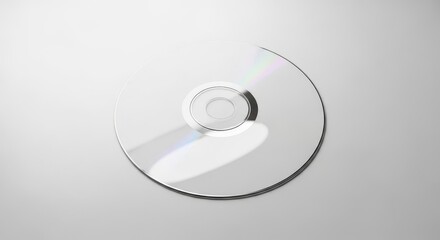 A blank white picture frame stands on a wooden surface next to a small potted succulent plant against a gray wall.