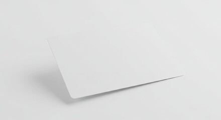 White rectangular card with rounded corners casting a shadow on a bright white surface
