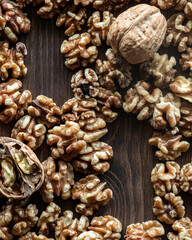 Walnuts on a wooden table with copy spaces.