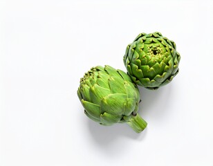 Fototapeta premium Two fresh raw artichokes isolated on white background. Top view.