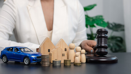 Businesswoman with gavel deciding family property law and financial investment concept