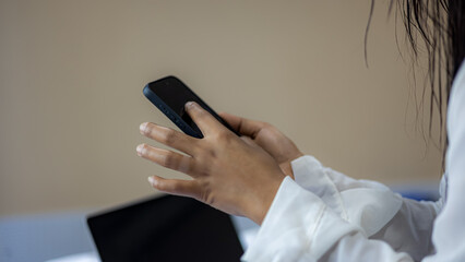 Woman using smartphone for online communication and digital lifestyle concept