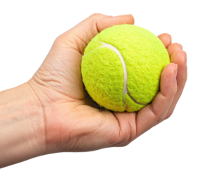 A close-up of a human hand holding a bright yellow tennis ball, isolated against a black backdrop
