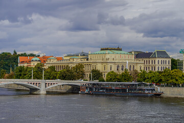 Beautiful Aerial view of Pragues National Theatre (Národní divadlo) at night with view of the city and the Vltava
