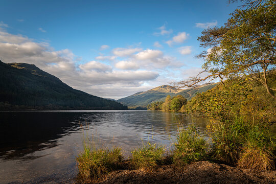 A sunny, autumnal HDR image of Loch Eck looking north from the shore of Jubilee point picnic site, Argyll and Bute, Scotland.