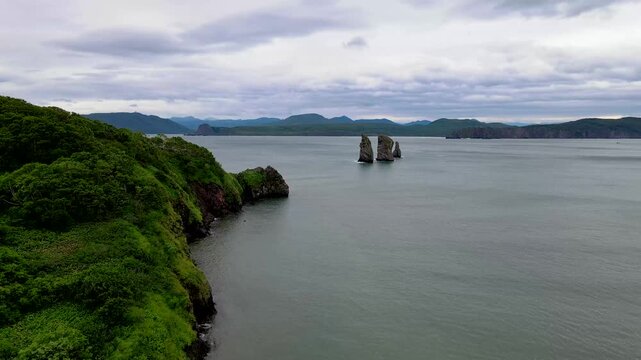 Kamchatka aerial panorama of Three Brothers rocks and coastline in Avacha Bay, Russia.
