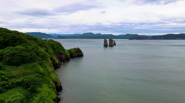 Kamchatka aerial panorama of Three Brothers rocks and coastline in Avacha Bay, Russia.
