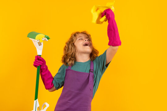 Housekeeping, home chores. Children helping with housekeeping, cleaning the house. Housekeeping at home. Cute child boy helping with housekeeping on yellow studio backdround. - Powered by Adobe