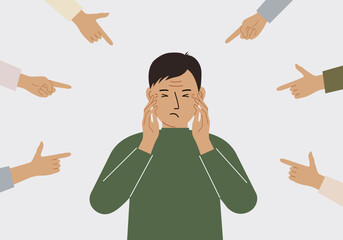 The concept of public condemnation, victim blaming and bullying. Crying depressed man. The fingers point at the character and hate him. Internet cyberbullying.