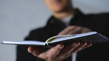 A man flips through the pages of a book and engrossed in a gripping detective novel in the library.
Reading a book and self-improvement.
A smart guy with a book in his hands.