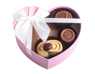 A heart-shaped pink box holds chocolates with a white ribbon and bow tied over them