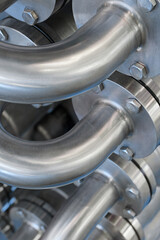 Curved stainless steel pipes, part of industrial cooling system