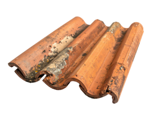 Weathered terracotta roofing tiles arranged against a solid black background, showing ridges