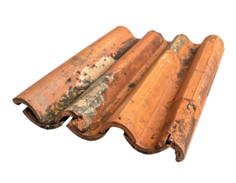 Weathered terracotta roofing tiles arranged against a solid black background, showing ridges