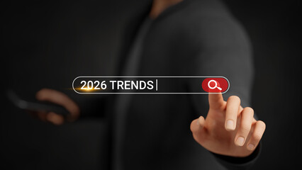Businessman searching 2026 trends on virtual screen. AI, cybersecurity, e-commerce, automation, blockchain, finance, healthcare, remote work, biotechnology, sustainability, green business. 3D graphic