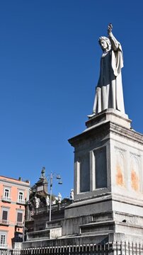 Naples, Italy, December 27, 2024. Vertical footage featuring the Statue of Dante Alighieri monument. Tourist attractions.