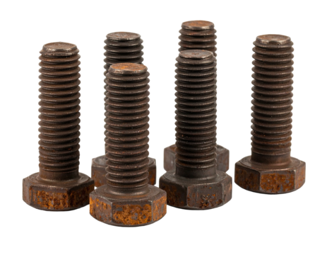 Group of weathered, rusty bolts with hexagonal heads against a black background