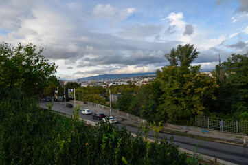Fototapeta premium Evening View of Tbilisi with Mountains and Sky