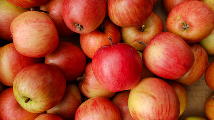 Top view of bright ripe red apples background