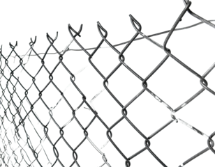 Close-up of a metal chain-link fence with sharp barbs against a black background