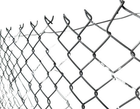 Close-up of a metal chain-link fence with sharp barbs against a black background