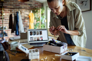 Young woman selling handmade jewelry online