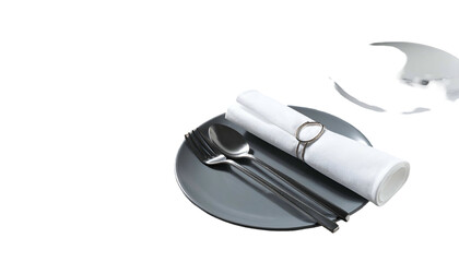 Close up of a gray plate with silverware and neatly rolled white napkin