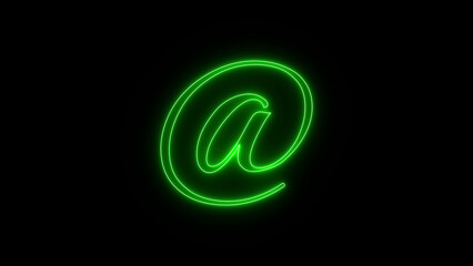 Glowing green neon at symbol illuminated against a dark black background with sparkles