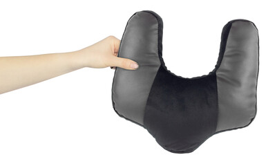 Neck pillow in hand, outstretched arm with neck pillow, isolated from background