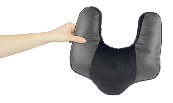 Neck pillow in hand, outstretched arm with neck pillow, isolated from background
