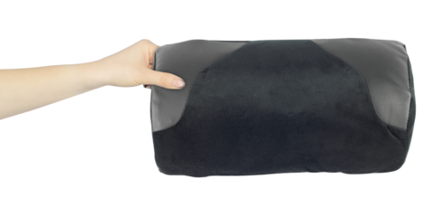 Chair back cushion for posture support in hand, outstretched arm with chair back cushion for posture support, isolated from background