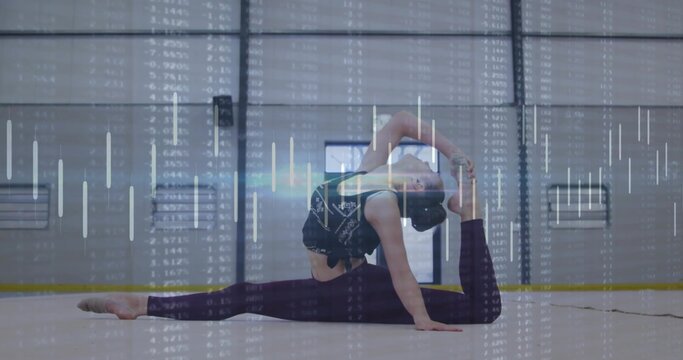 Fototapeta Stretching gymnast wearing sports bra, leggings performing side-split backbend on gym floor