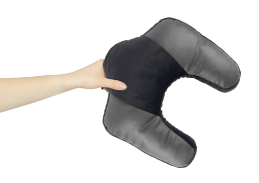 Neck pillow in hand, outstretched arm with neck pillow, isolated from background