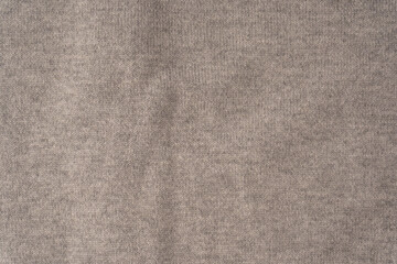 Soft grey merino wool sweater texture as a background.