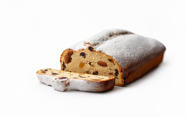 Traditional German Stollen Bread Isolated on White Background. A delicious German Christmas stollen bread filled with marzipan, nuts, and dried fruits, covered with powdered sugar.