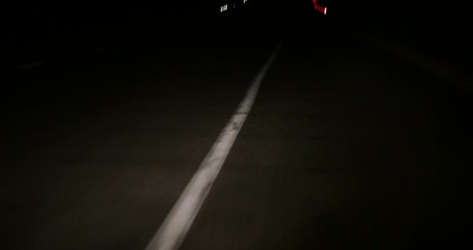 illuminated dividing strip and road markings when the car's headlights are on at night