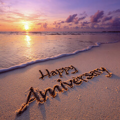 “Happy Anniversary” Handwritten in Smooth Golden Wet Sand with Sunset Glow – ideal for wedding keepsakes
