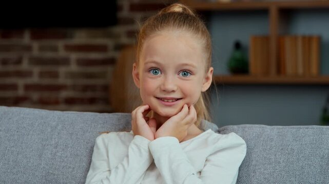 Portrait Caucasian little child girl kid daughter amazed open mouth looking at camera wonder at home surprise reaction funny look big eyes feeling shock saying wow good news achieve happy childhood