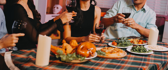 Diversity, dinner and group of people toast celebration together at party. Friends, happy and celebrate with food, wine and friendship for love, support and cheers champagne at business function