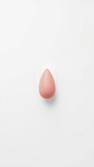 Isolated textured pink teardrop shape against a bright white background, no people.