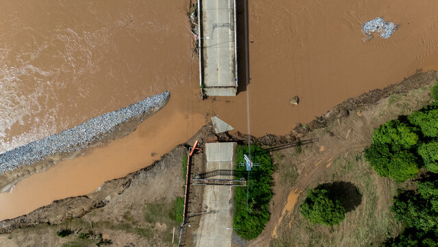Aerial view of a broken bridge in Doi Hang subdistrict after Typhoon Yagi has swept Chiang Rai province of Thailand.