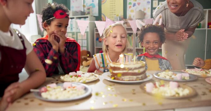 Birthday, party and children with blowing of candles for celebration, development and growth of child. Happy, friends and smile with cake in classroom at table for special event, love and support - Powered by Adobe