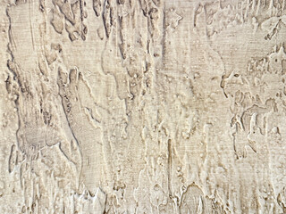 Decorative 3d white textured paint on a wall or panel. Weathered white beige paint random stroke pattern, rough uneven surfaces. Suitable for bark, bump, paint, or graphic background. 