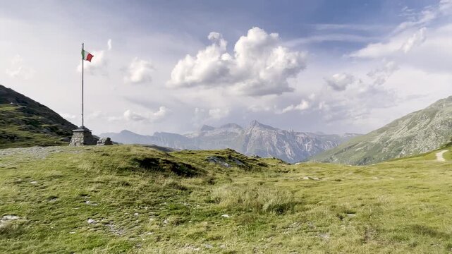Slow zoom on Splugen Pass with Italian flag and Teurihorn