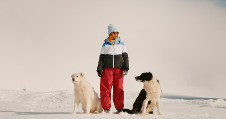 Woman standing up from between two mountains dogs. Mountains landscape background and woman with...