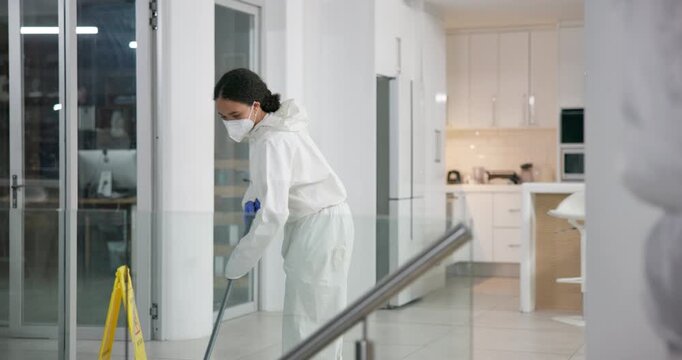 Woman, cleaning and mopping or disinfect with professional, team and sterilization for health care service. Office, germ protection and virus with safety suit or exposure, fumigation and hygiene mask