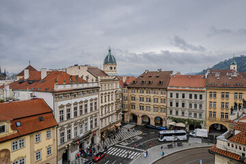 Beautiful aerial view St. Nicholas Church in the Lesser Town of Prague, Czech Republic — stunning baroque masterpiece surrounded by colorful old buildings and cobblestone streets
